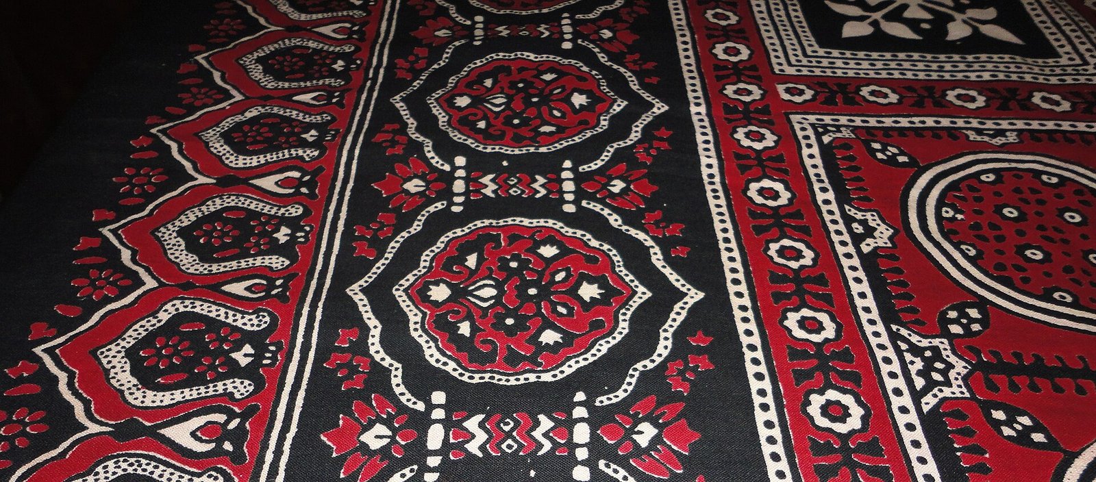 Ajrak Ajrak (Sindhi: اجرڪ) is a name given to a unique form of blockprinted shawls and tiles found in Sindh, Pakistan. Ajraks are also worn
